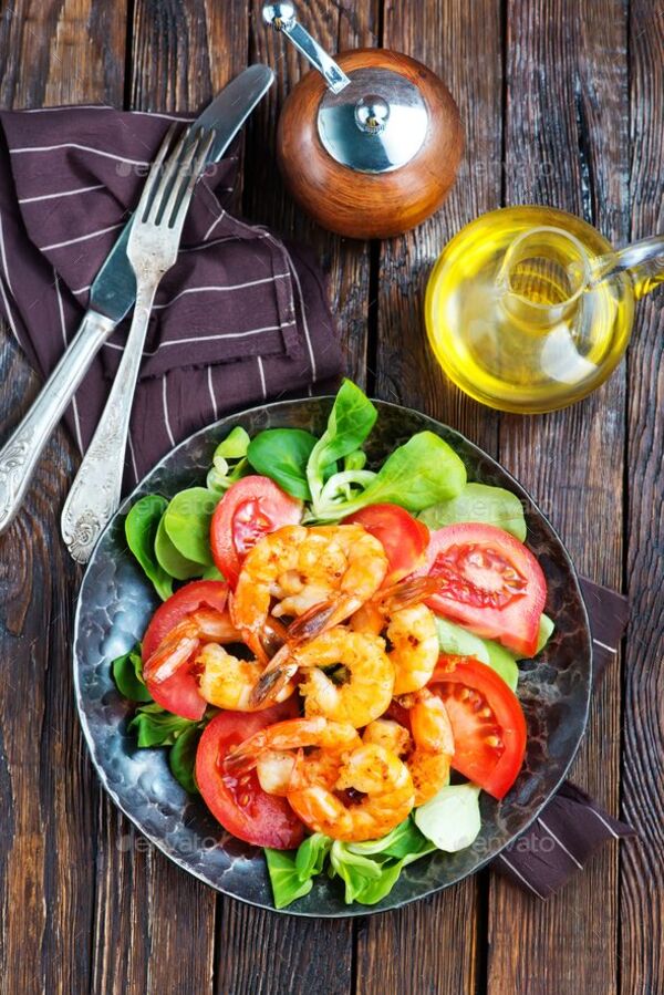 A table with colorful salad ingredients